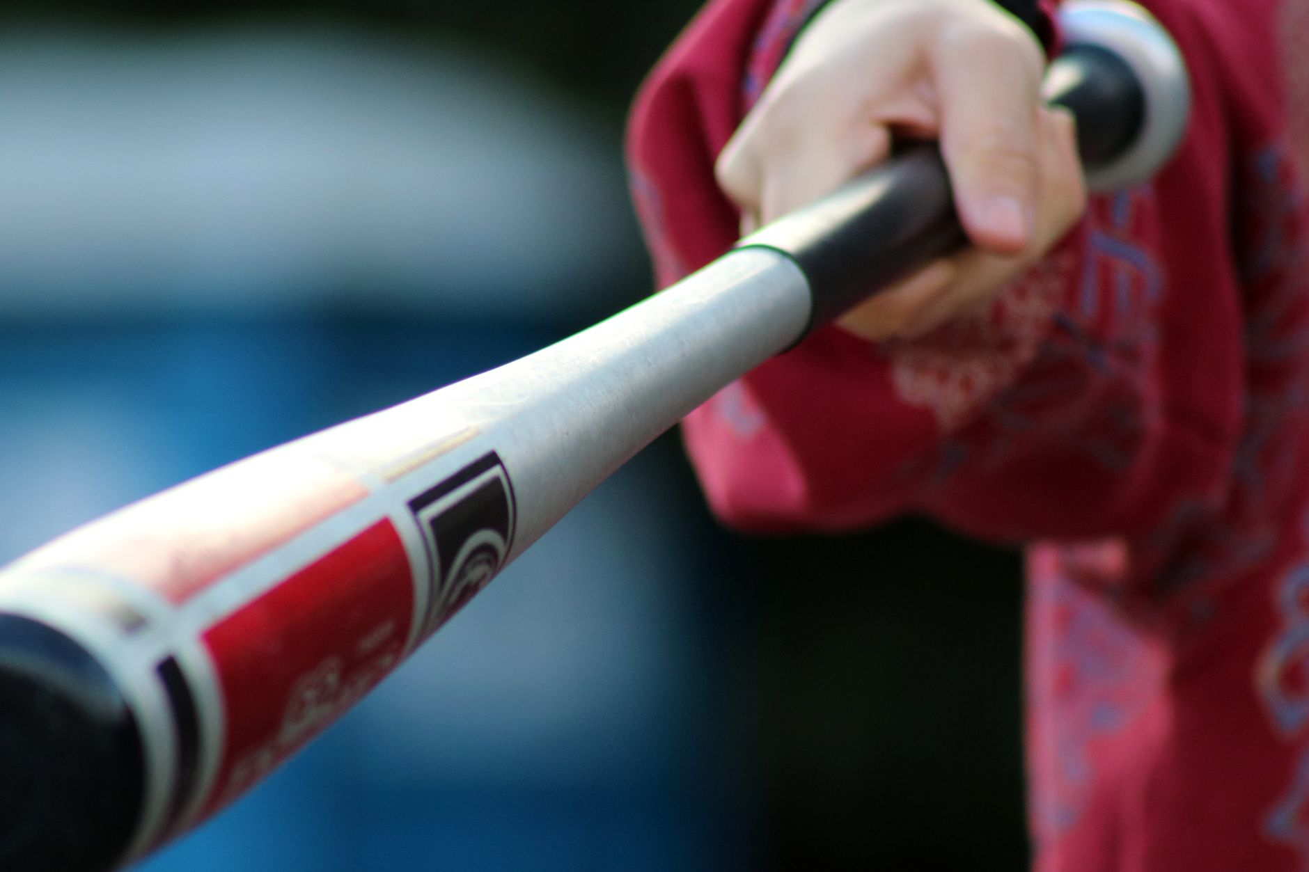 Row of baseball bats in a rack